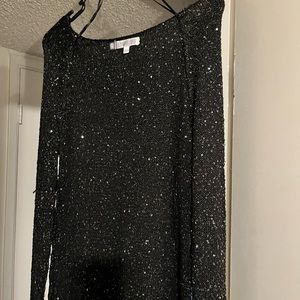 A Jennifer López very glittery sweater light weight.